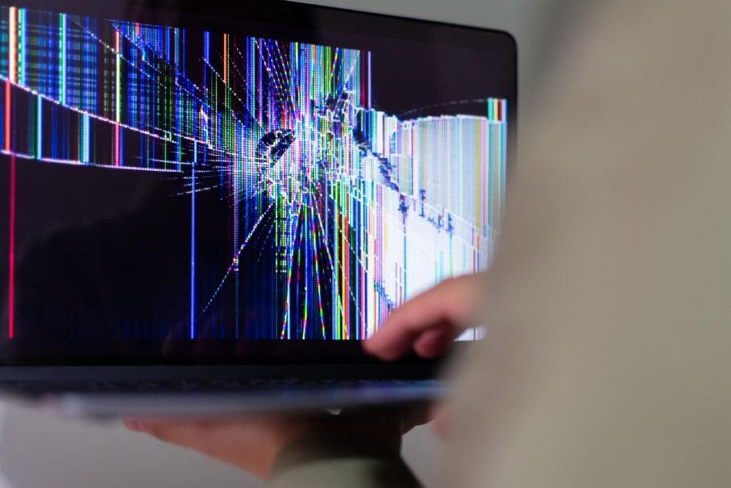Glitched laptop screen, showing how abandoned websites break down over time