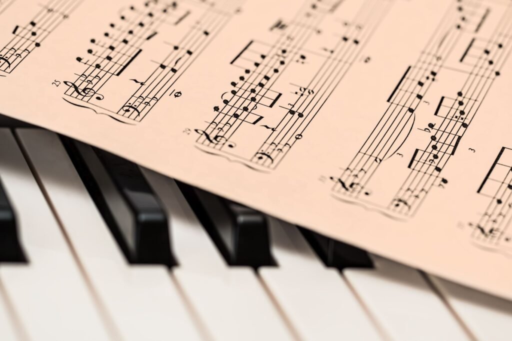 Piano keys and sheet music, showing the simple melodies that often become an earworm