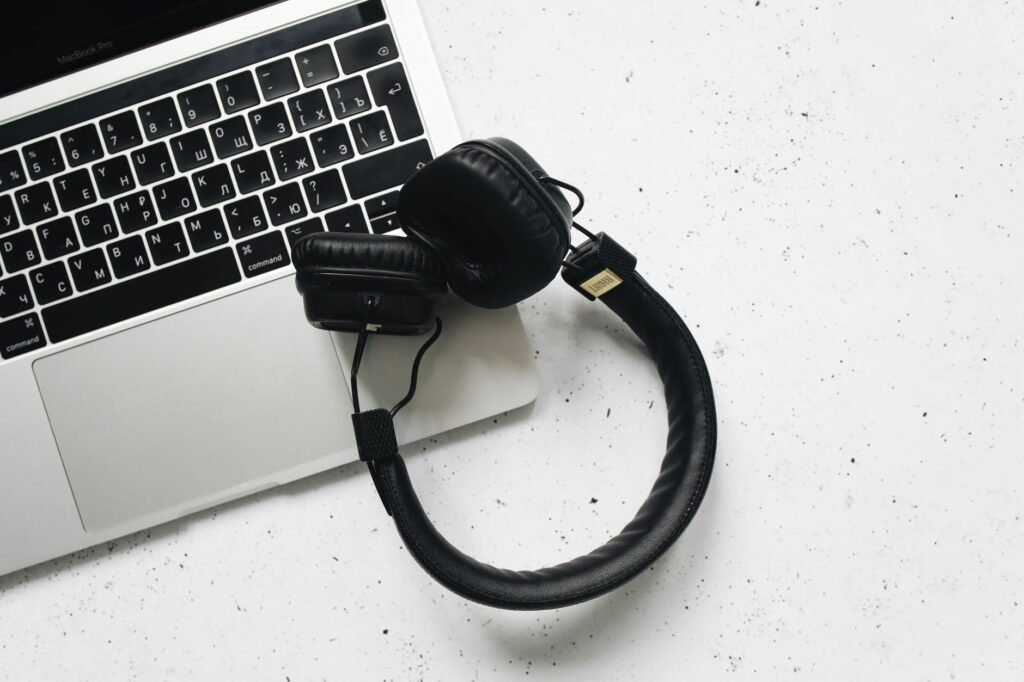 Headphones resting on a laptop, a simple way to block out background speech