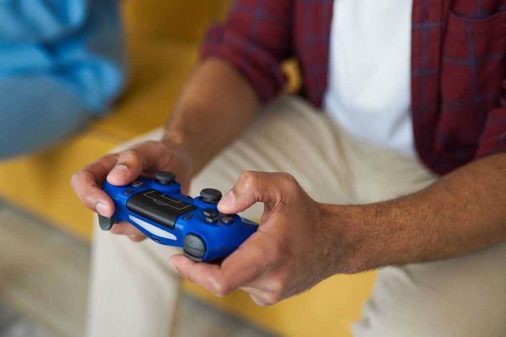 Game controller in front of a modern console with cloud saves