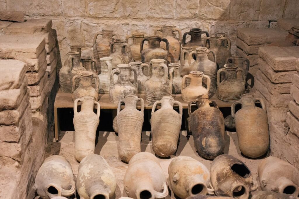 Ancient clay amphorae displayed in a museum