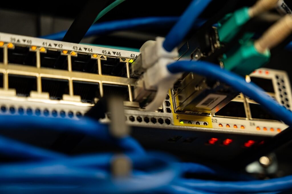 Network switch with ethernet cables, part of the shared network that explains why is my WiFi slow at night during peak hours