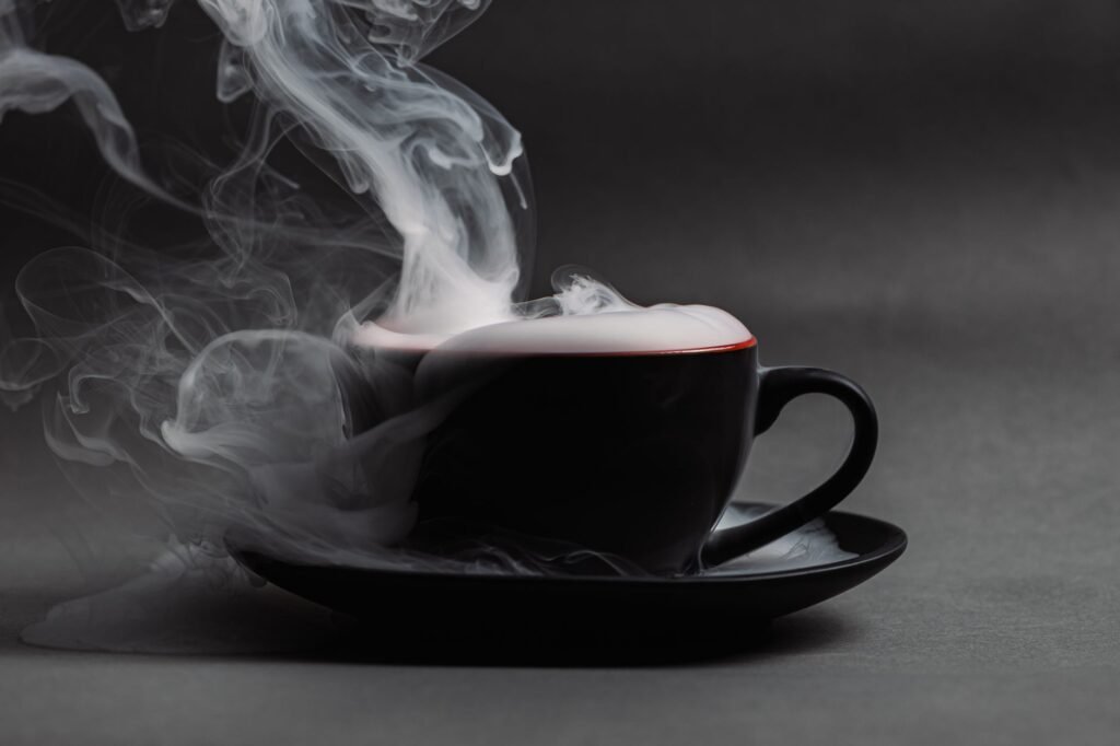 Steaming cup of coffee, showing why coffee smells better than it tastes as the aroma rises