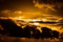 Sun breaking through dark clouds, like mood changes for no reason