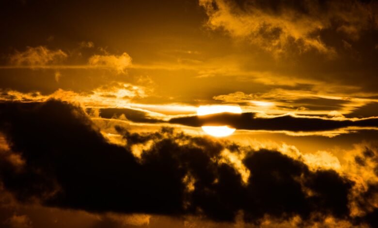 Sun breaking through dark clouds, like mood changes for no reason