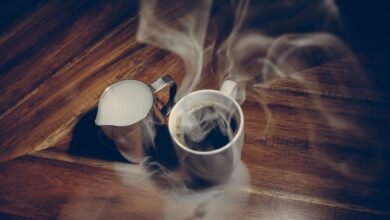 Steaming cup of fresh coffee, showing why coffee smells better than it tastes