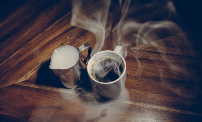 Steaming cup of fresh coffee, showing why coffee smells better than it tastes