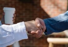 Two people shaking hands, the moment you ask why do I forget names so fast