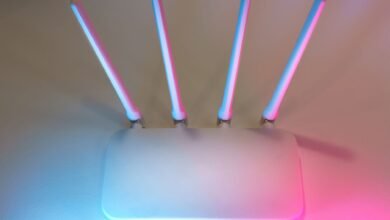 Wireless router glowing at night, the device most people blame when asking why is my WiFi slow at night