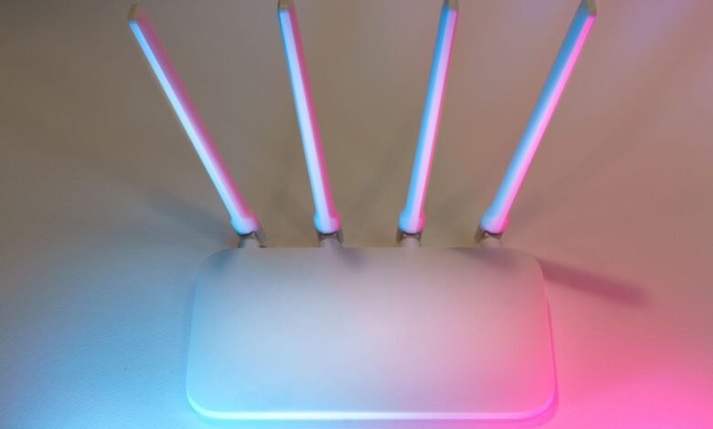 Wireless router glowing at night, the device most people blame when asking why is my WiFi slow at night